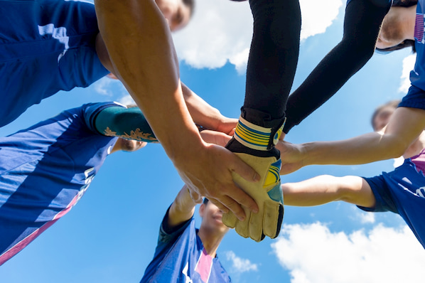 athletes huddle up before their next San Diego game