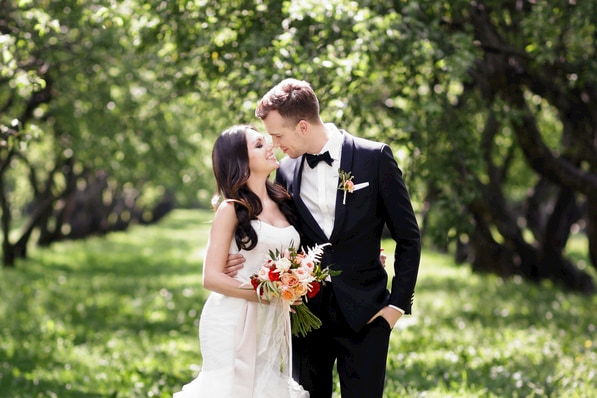 happy bride and groom pose for a photo after their San Diego wedding