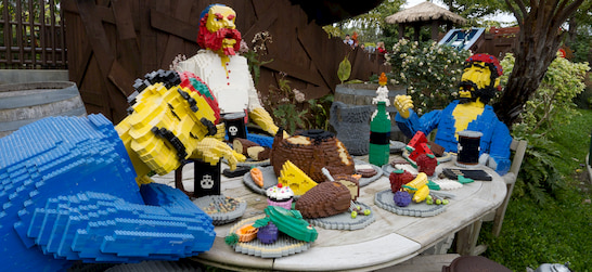 Lego sculptures in the shape of pirates eating a feast at LegoLand California